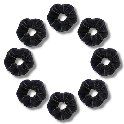 8 Black Velvet scrunchies arranged in a circle